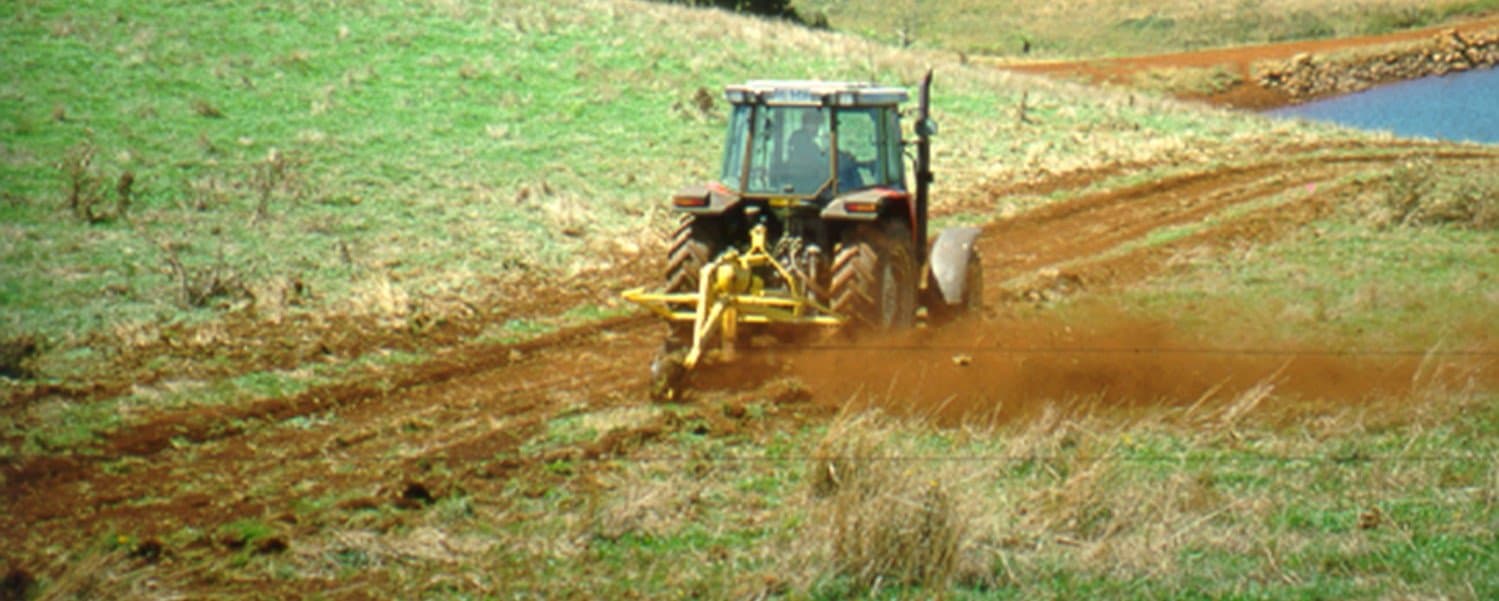 Figure 51. Wide flat-bottomed waterway being installed using a rotary drainer.